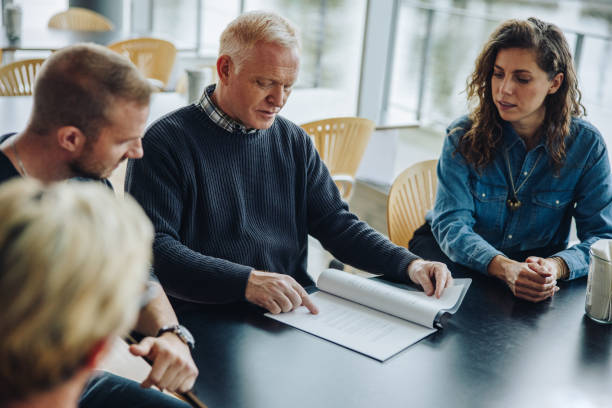 istock Business team discussing over a contract in meeting 1339045815