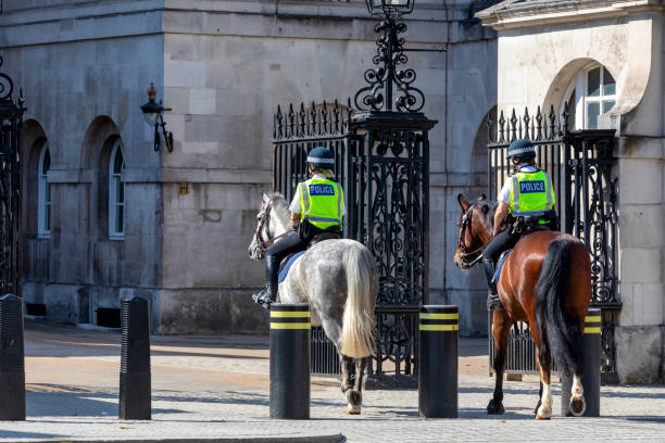 London Metropolitan Police London, UK - Aug 19, 2021: Female mounted police on London Parliament Street. metropolitan police stock pictures, royalty-free photos & images