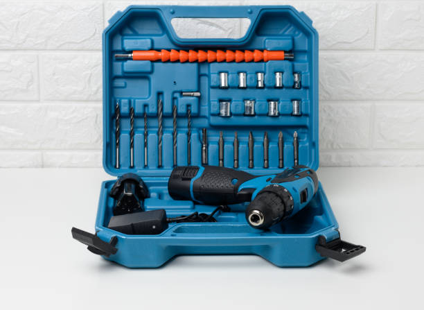 istock portable drill on a battery in an open plastic suitcase with attachments on a white table 1339049351