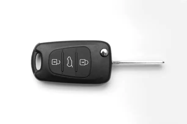 Car key with remote function on white background