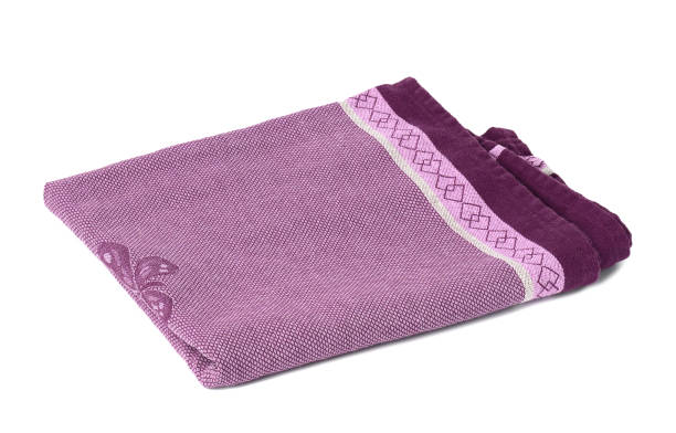 istock folded purple linen towel on white background, top view 1339050324