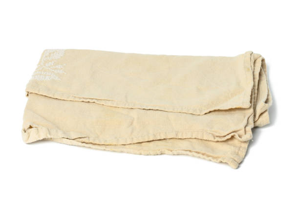 istock folded beige linen towel on white background, top view 1339050400
