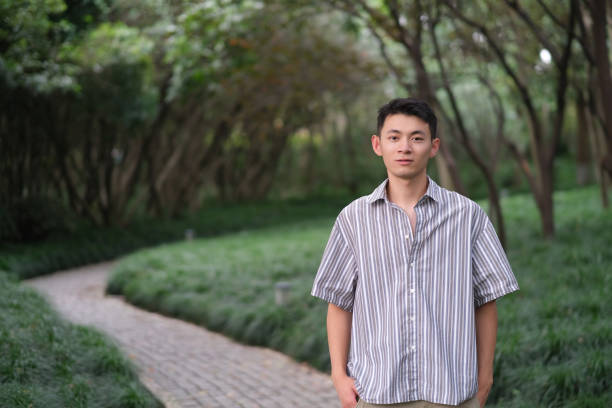 istock handsome Asian young man at natural green park 1339051344