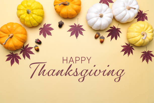 istock Happy Thanksgiving Day with pumpkin and nut on yellow background 1339051420