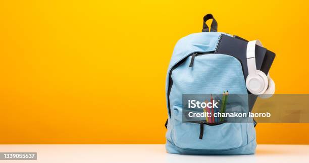 Back To School Background Stationery Supplies In The School Bag Banner Design Education On Yellow Background Stock Photo - Download Image Now
