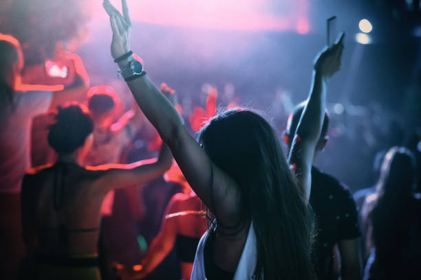 istock Woman enjoying a concert party 1339055752