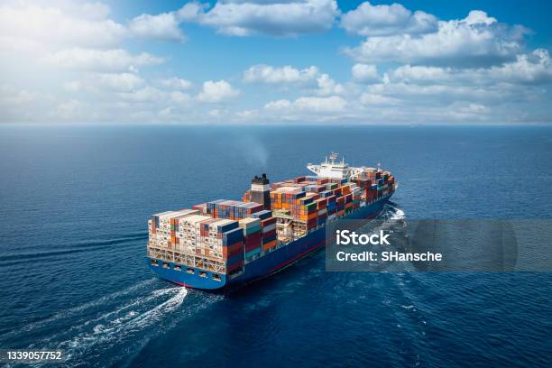 A Large Container Cargo Ship In Motion Stock Photo - Download Image Now - Freight Transportation, Container Ship, Ship