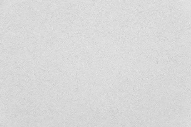 istock Rough plastered and white painted wall 1339060566