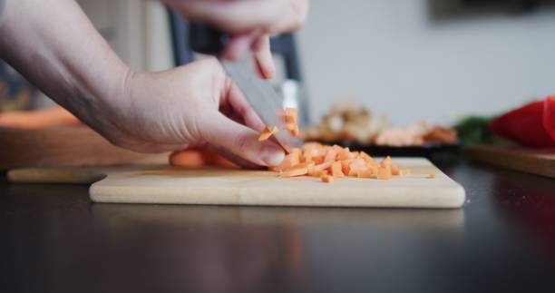 istock Making and serving vegetable soup in domestic kitchen 1339060907