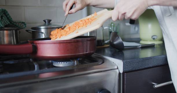 istock Making and serving vegetable soup in domestic kitchen 1339060966