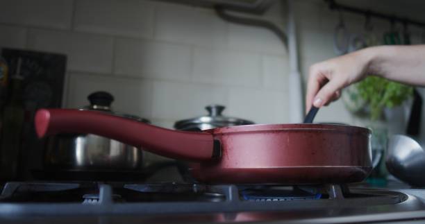 istock Making and serving vegetable soup in domestic kitchen 1339061070
