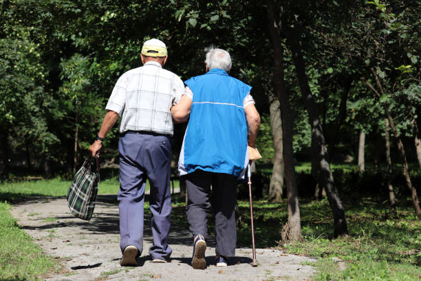 Rear view shot of a senior couple going for a city walk. Galicia, Spain.