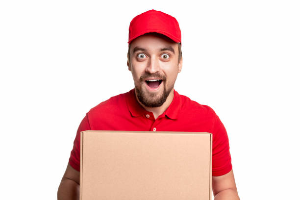 istock Amazed delivery man with carton box 1339066675