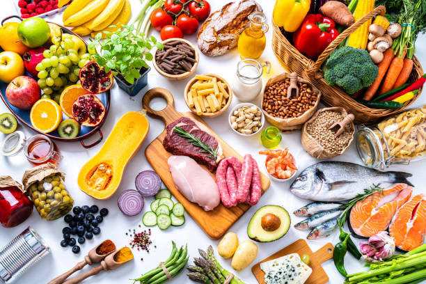 istock Large group of different types of food on white 1339066967