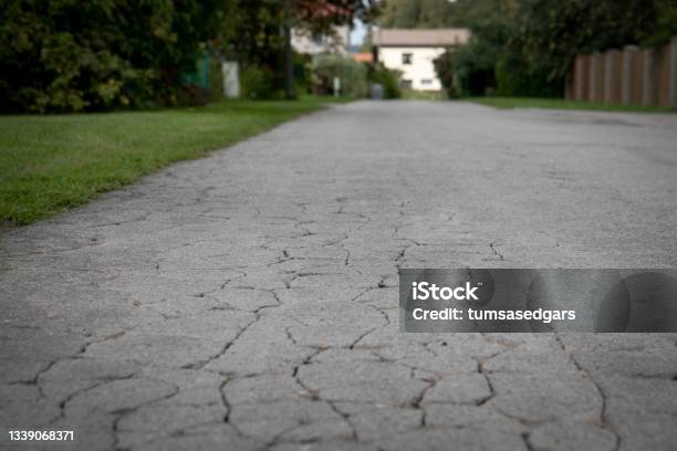 City Street View With Old Cracked Asphalt Pavement Stock Photo - Download Image Now - Abstract, Aging Process, Asphalt