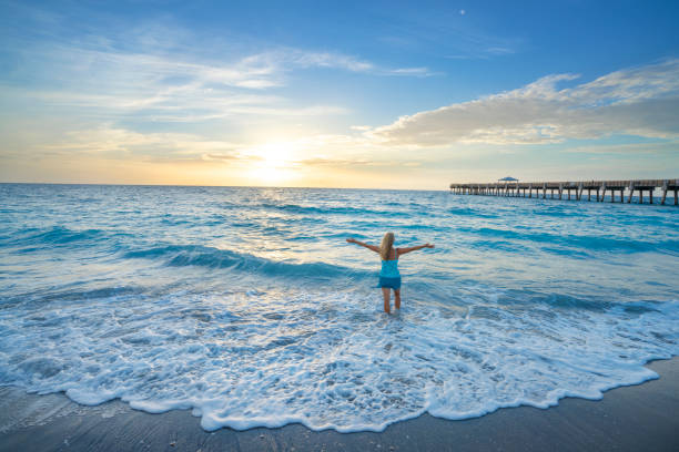 istock Woman relaxing on beautiful Florida beach. 1339069488
