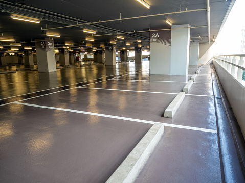 Clean and glossy flooring of the Parking lot in the parking building