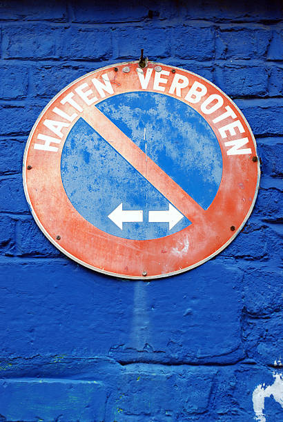 istock Halten Verboten german sign on blue wall 133907236