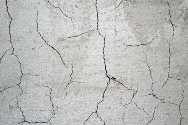 Photo of Cracked cement after drying .