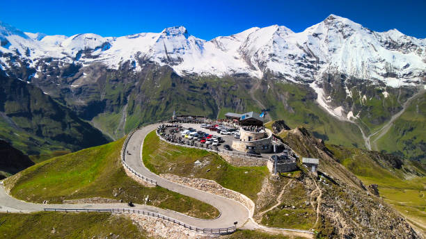 Amazing aerial view of Grossglockner mountain peaks covered by snow in summer season. Drone viewpoint over Edelweiss Spitze. Amazing aerial view of Grossglockner mountain peaks covered by snow in summer season. Drone viewpoint over Edelweiss Spitze grossglockner stock pictures, royalty-free photos & images