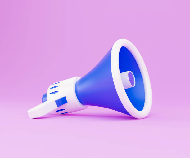istock Megaphone on pink background. 3d render illustration with copy space. 3d render white and blue portable cordless megaphone lies on a pastel pink background. Getting your message through 1339074515