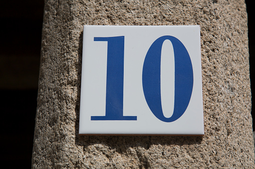 Closeup of Number Ten on Stone Wall