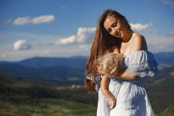 istock Mother and daughter and mountain views 1339078405