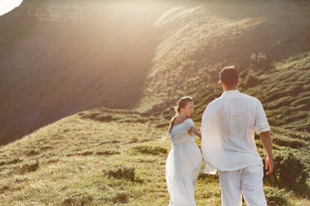 istock Couple walk in the mountains 1339078625