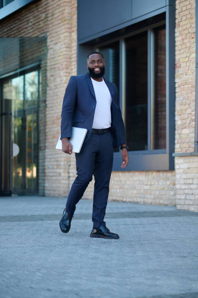 istock A dark-skinned man in a suit on his way to work 1339085116