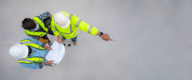 istock Banner : Civil engineer inspect structure at construction site against blueprint, Building inspector join inspect building structure with civil engineer. Civil engineer hold blueprint inspect building 1339085163