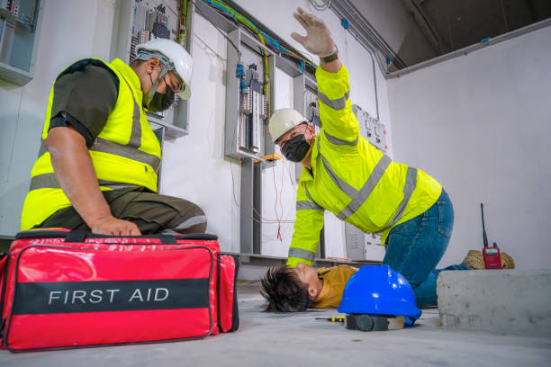 istock Electric worker suffered an electric shock accident unconscious. Safety team CPR for first aid Electric worker loses in electric shock accident at work on site. Accident in control room of factory. 1339085249