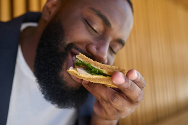 istock A dark-skinned maneating snadwich with a big appetite 1339085305