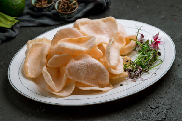 istock Vietnamese shrimp chips on plate on dark stone table 1339086374