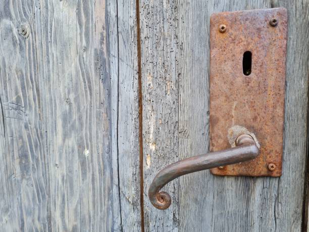 istock old rusted door handle on a wooden door 1339086739