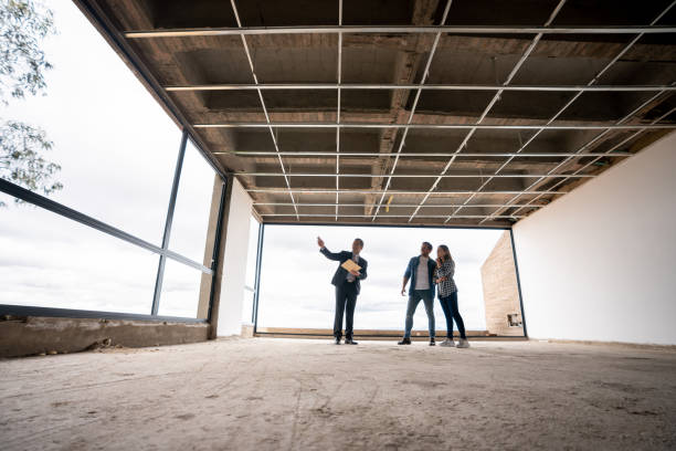 istock Architect showing an apartment in a building under construction to a couple 1339089812