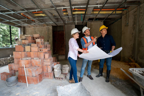 istock Team of architects and engineers working together at a construction site 1339089848