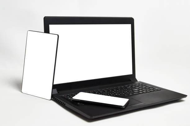 istock Blank laptop display and mobile phone on white background 1339091406