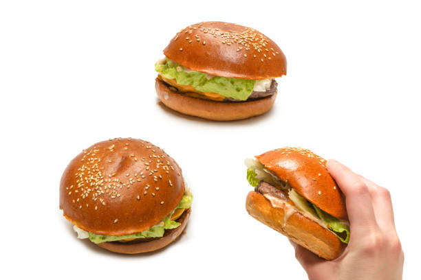 istock Hamburger in woman hands isolated on a white background. 1339091653