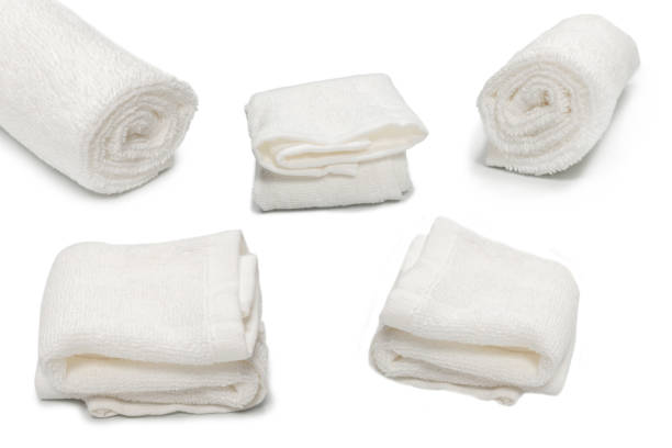istock White fluffy cotton towel isolated on a white background. 1339091682