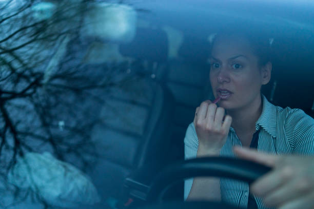 istock Successful businesswoman driving car 1339094941