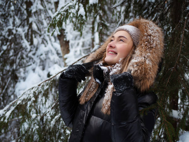 istock Winter walk through the forest, snow-covered beautiful pine forest. 1339095806