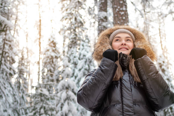 istock Winter walk through the forest, snow-covered beautiful pine forest. 1339095829