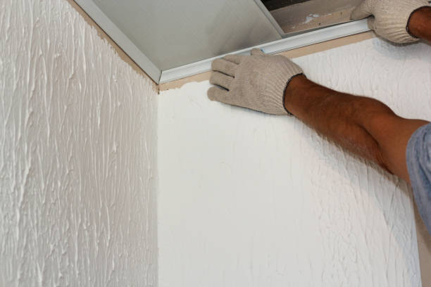istock Installation of the side skirting board by sliding it onto the panel. 1339100584