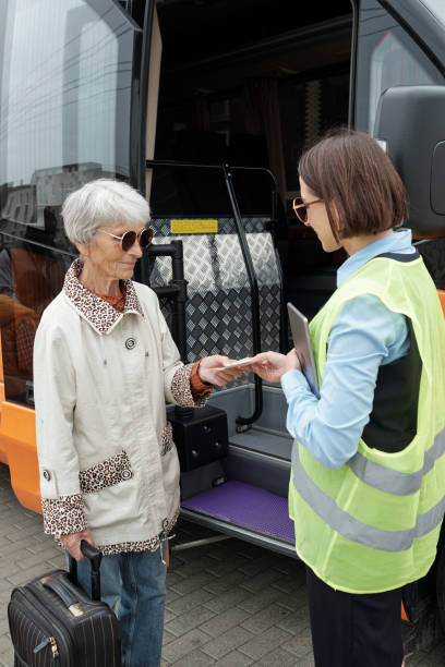 istock Giving Ticket To Bus Conductor 1339106298