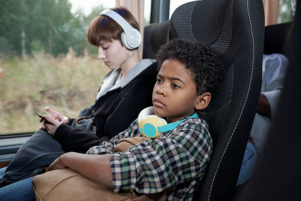 istock Serious Black Boy In Bus 1339106431