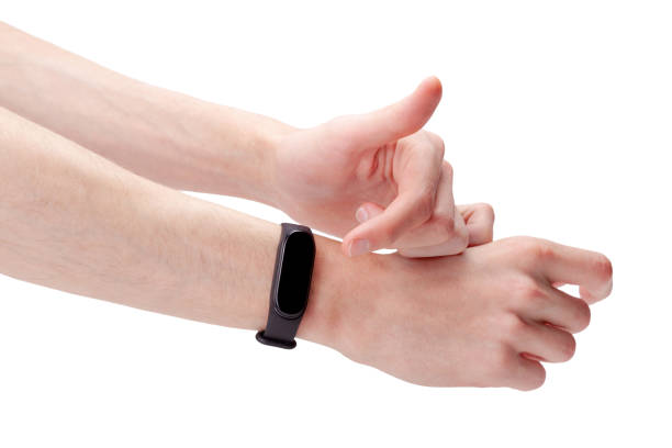 istock Man wearing, using a smart band, smartwatch, fitness sport activity tracker watch accessory pointing at the empty blank touch screen display with his finger, hands, gesture isolated on white, cut out 1339107013