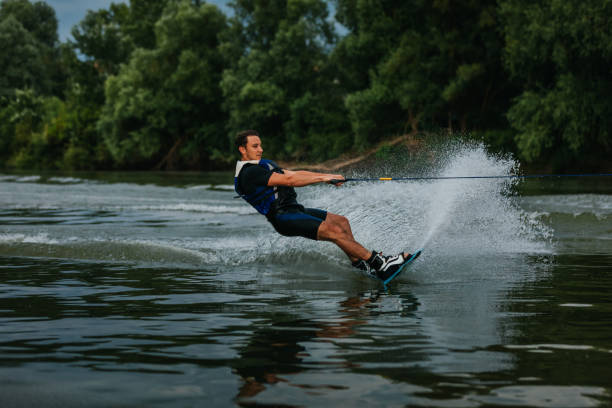 istock Male wake-boarder on lake 1339108318