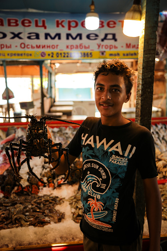 Hurghada, Egypt - August 26, 2021: Fish Market at Hurghada is filled with various sea food. Everything they sell is fresh from the Red Sea.  All sorts of fish, shell and crustaceans