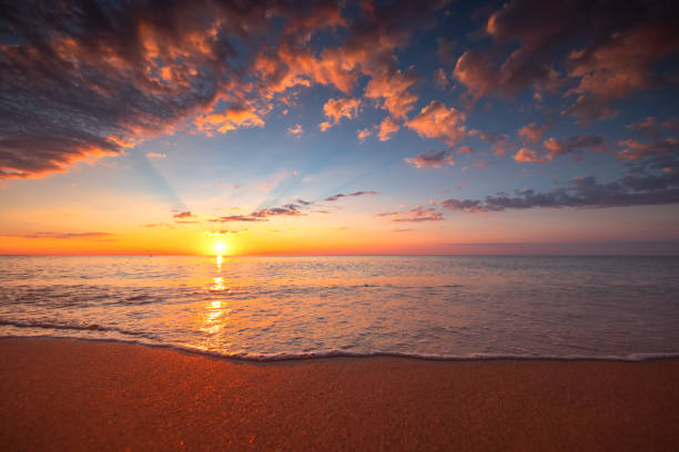 Beach sunrise over the tropical sea