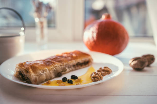 Pumpkine pie with nuts and raisins for halloween breakfast.